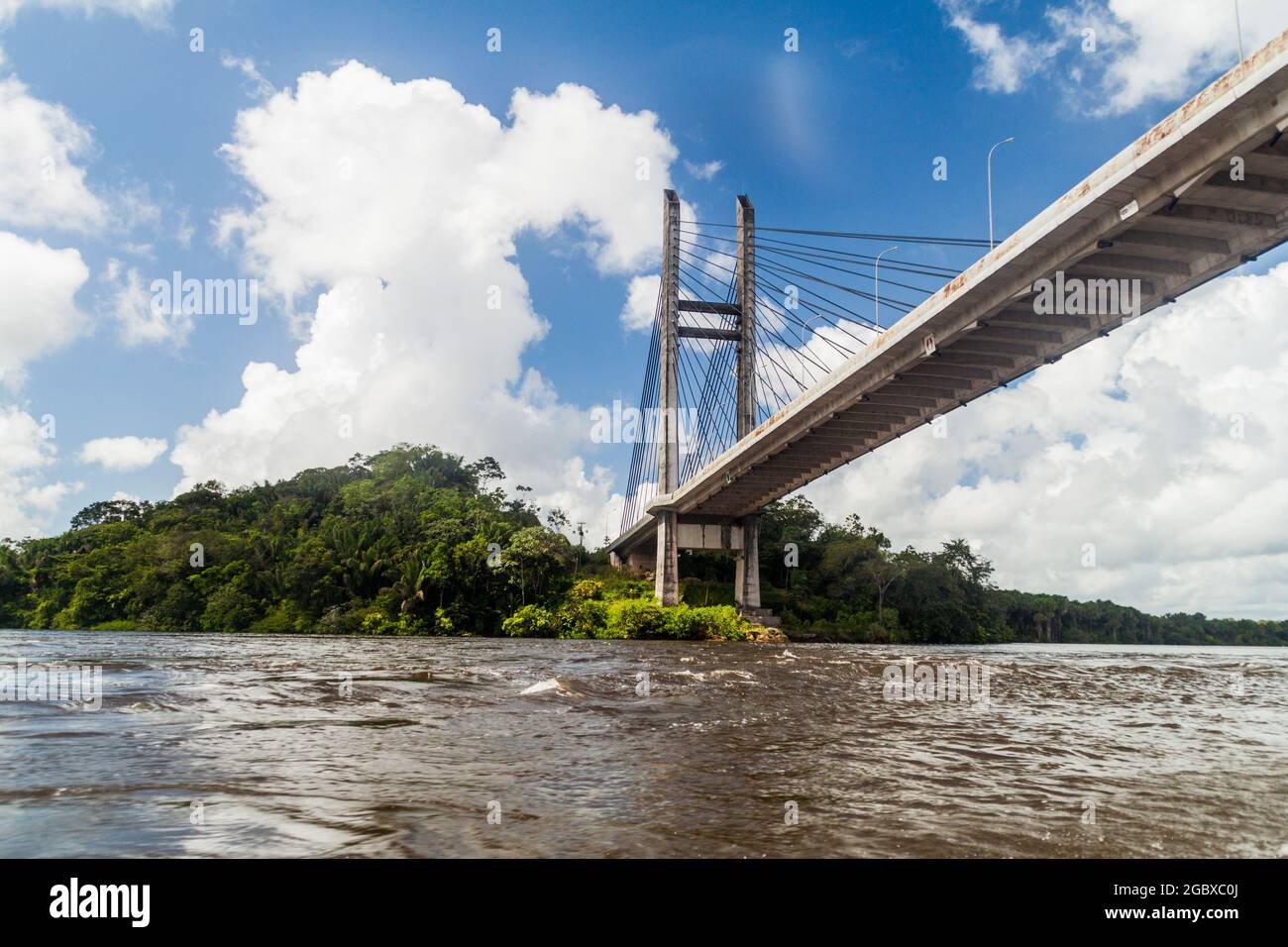 Bridge over river Oyapock (Oiapoque) between French Guiana and Brazil Stock Photo