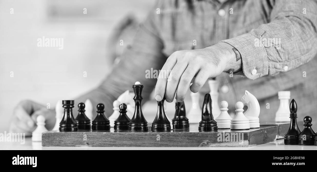 Chess is rarely game of ideal moves. Development logics. School teacher. Playing chess. Intellectual hobby. Chess lesson. Strategy concept. Thinking Stock Photo