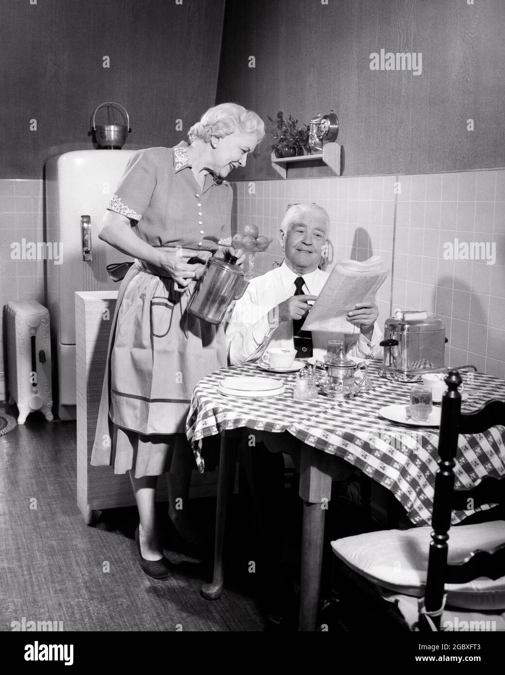 https://c8.alamy.com/comp/2GBXFT3/1950s-elderly-senior-retired-couple-at-apartment-kitchen-table-having-breakfast-woman-pouring-coffee-for-man-reading-newspaper-d366-har001-hars-having-communication-toaster-information-strong-lifestyle-satisfaction-elder-females-married-spouse-husbands-healthiness-home-life-copy-space-friendship-half-length-ladies-persons-caring-males-senior-man-senior-adult-apartment-bw-partner-senior-woman-happiness-old-age-pour-oldsters-high-angle-oldster-in-elders-connection-personal-attachment-affection-emotion-togetherness-wives-black-and-white-caucasian-ethnicity-har001-old-fashioned-percolator-2GBXFT3.jpg