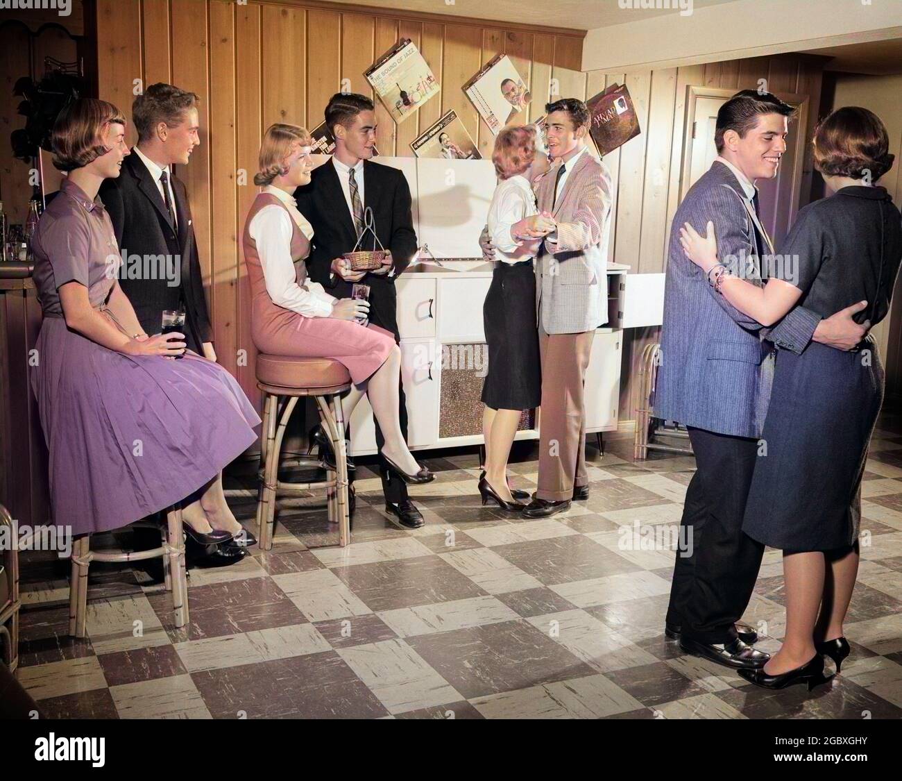 1950s 1960s FOUR TEEN COUPLES GIRLS AND BOYS HAVING RECORD MUSIC DANCE  PARTY AFTER SCHOOL IN SUBURBAN BASEMENT RECREATION ROOM - j104c HAR001 HARS  INDOORS RECORD NOSTALGIC PAIR 4 SUBURBAN COLOR OLD