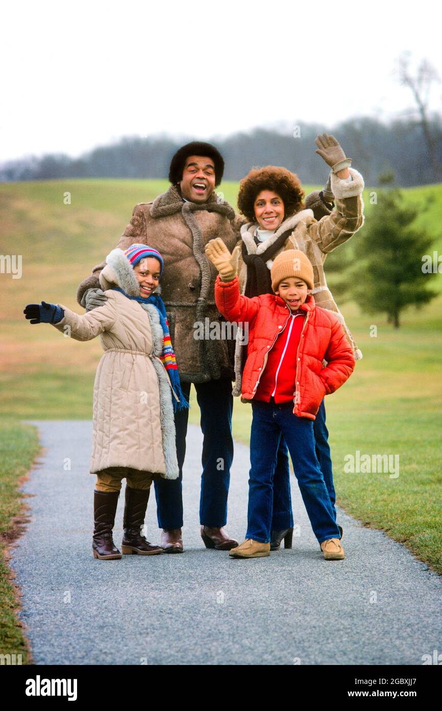 1970s 1980s PORTRAIT AFRICAN-AMERICAN FAMILY MOTHER FATHER TWO KIDS OUTDOORS WEARING HATS COATS GLOVES LOOKING WAVING AT CAMERA - kj9010 PHT001 HARS LADY WEARING COLD COUPLES HUSBAND DAD GOODBYE WEATHER MOM HATS CLOTHING NOSTALGIC PAIR 4 COLOR MOTHERS OLD TIME NOSTALGIA BROTHER OLD FASHION SISTER 1 GREETING JUVENILE STYLE WELCOME COMMUNICATION SONS PLEASED FAMILIES JOY LIFESTYLE SATISFACTION FEMALES MARRIED BROTHERS RURAL SPOUSE HUSBANDS COATS HEALTHINESS HOME LIFE COPY SPACE FRIENDSHIP FULL-LENGTH LADIES DAUGHTERS PERSONS MALES SIBLINGS CONFIDENCE SISTERS FATHERS PARTNER WINTERTIME Stock Photo