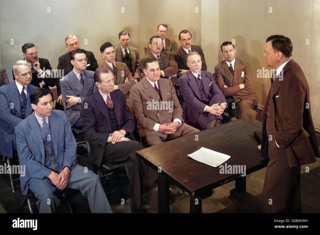 1930s 1940s 1950s MEETING OF A GROUP OF BUSINESSMEN SALESMEN IN A CLASSROOM FOR A SALES TRAINING LECTURE - s10205c HAR001 HARS MANAGER COPY SPACE HALF-LENGTH GROWN-UP PROFESSION SENIOR MAN EXECUTIVES MEET MIDDLE-AGED MAN LECTURE WHITE COLLAR OCCUPATION HIGH ANGLE NETWORKING OCCASION OCCUPATIONS POLITICS SEMINAR BOSSES STYLISH COOPERATION MANAGERS MID-ADULT MAN PEOPLE ADULTS SALESMEN TOGETHERNESS CAUCASIAN ETHNICITY HAR001 OLD FASHIONED Stock Photo