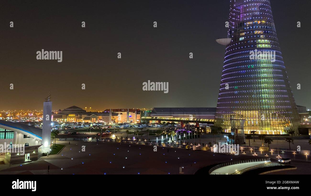 Scenic view of Villagio Mall and Torch Tower in Doha, Qatar, Middle East at night Stock Photo