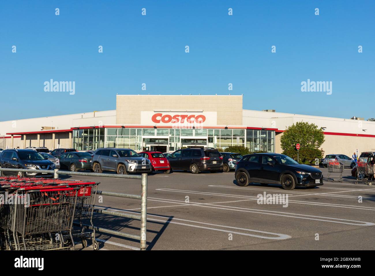 Ottawa, Canada - August 2, 2021: Costco Wholesale warehouse storefront and parking lot in Ottawa, Canada. Stock Photo