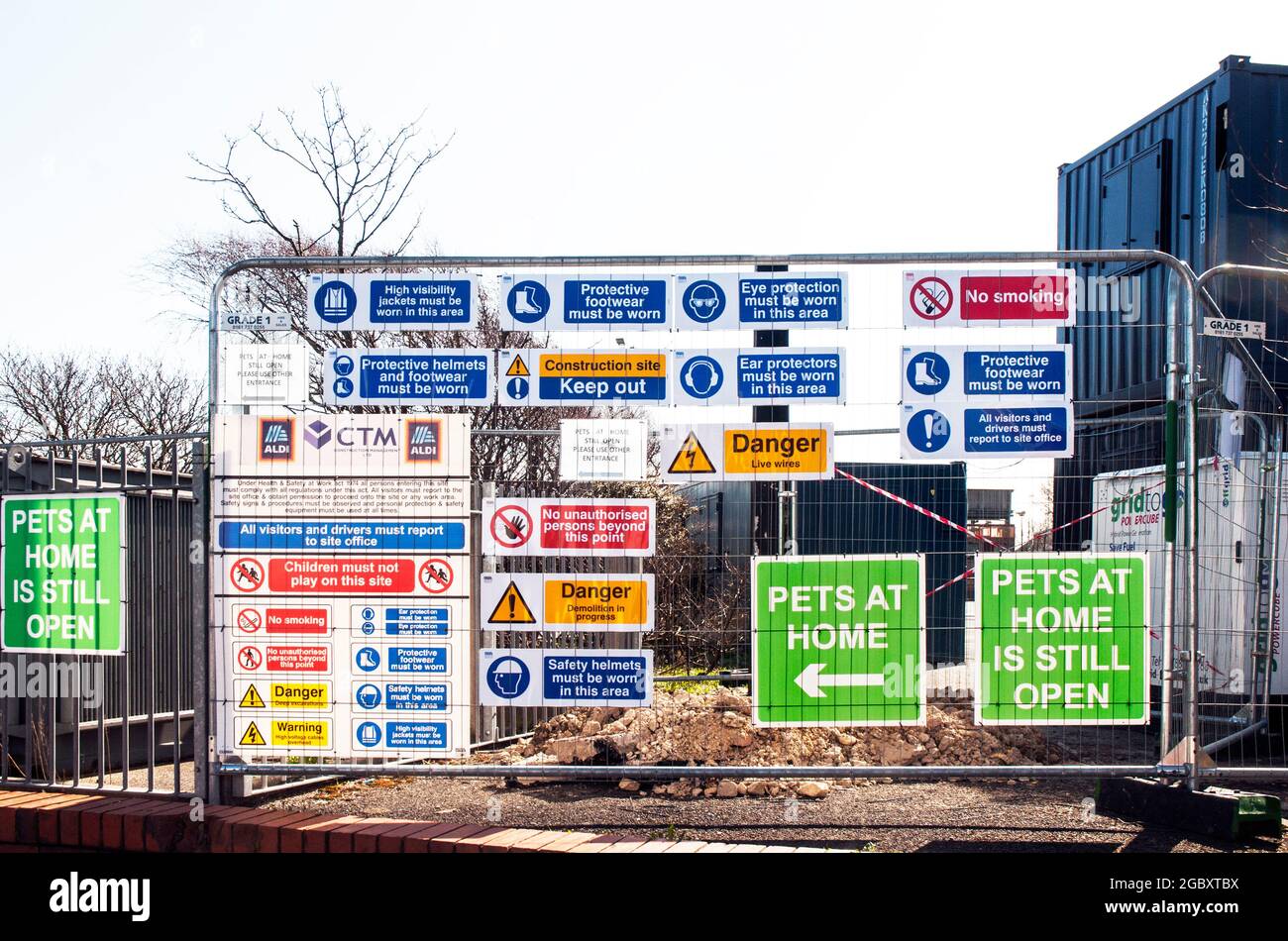 Notices of site rules and precautions to take before entering construction site. Red Prohibitive signs and blue Information signs.Green direction sign Stock Photo
