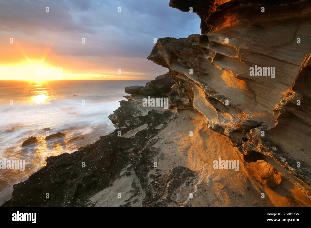 light on the rocks at coast Stock Photo - Alamy