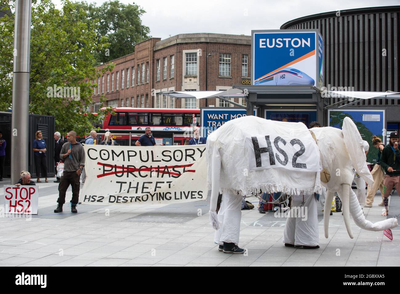 London, UK. 5th Aug, 2021. Stop HS2 campaigners use a HS2 white elephant to carry out outreach activities directly in front of a HS2 Routewide Roadshow at Kings Cross Square. There have been increasing doubts regarding the viability of the northern section of the HS2 high-speed rail link since a recent report published by the Infrastructure and Projects Authority gave Phase 2b the lowest 'red' rating, indicating that successful delivery of the scheme “appears to be unachievable”. Credit: Mark Kerrison/Alamy Live News Stock Photo