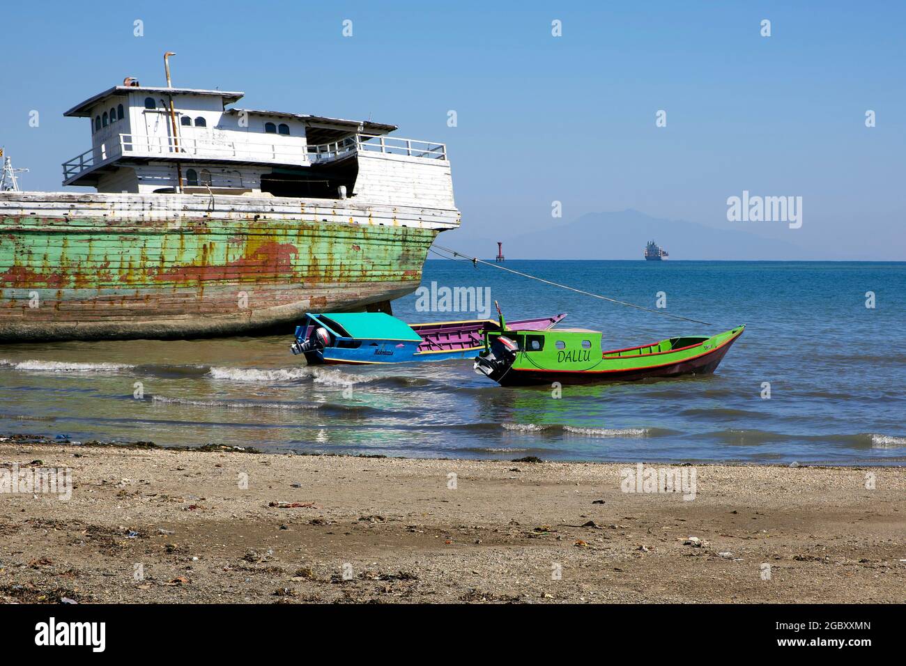 Fishing boats are moored on a Dili, Timor Leste beach. Stock Photo