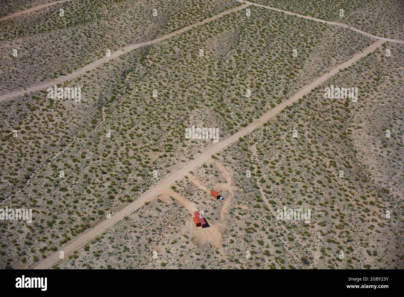 Containers mark out the site of proposed new homes in the desert near