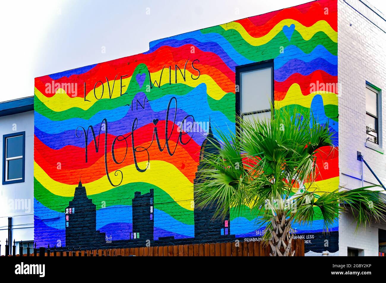 A “love wins” rainbow mural is painted on the wall at B-Bob’s Downtown, Aug. 1, 2021, in Mobile, Alabama. Stock Photo