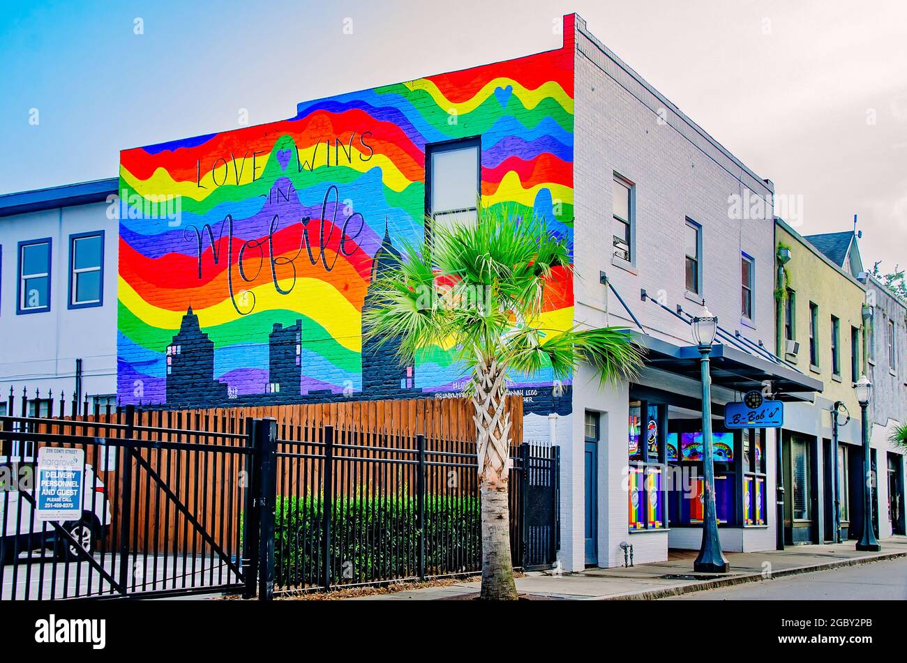 A “love wins” rainbow mural is painted on the wall at B-Bob’s Downtown, Aug. 1, 2021, in Mobile, Alabama. Stock Photo