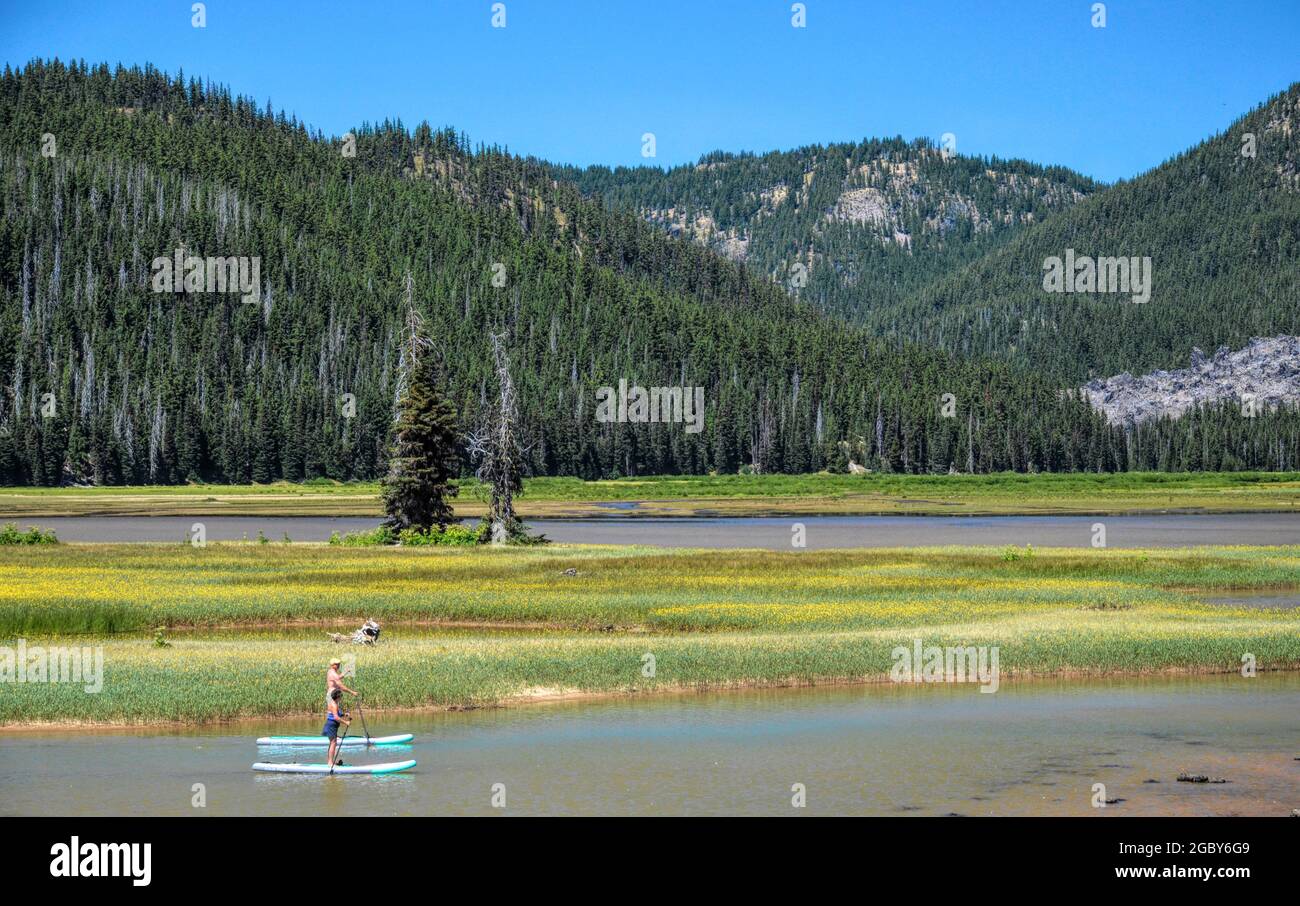 Paddleboarding on Sparks Lake near Bend, Oregon, USA Stock Photo