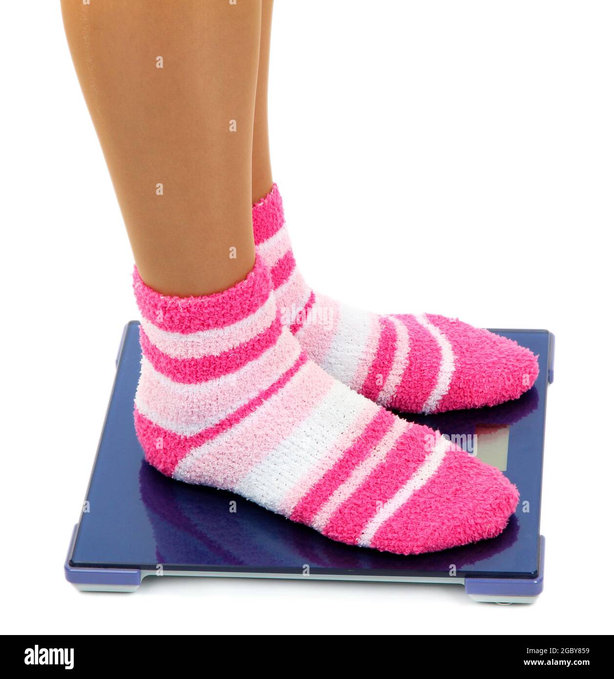 Feet on scales isolated on white Stock Photo Alamy