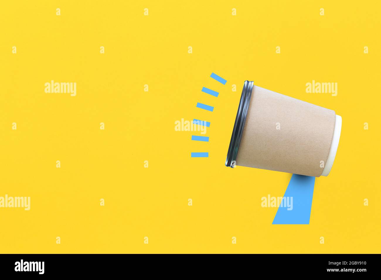 Paper coffee cup invented as a megaphone on yellow paper background for