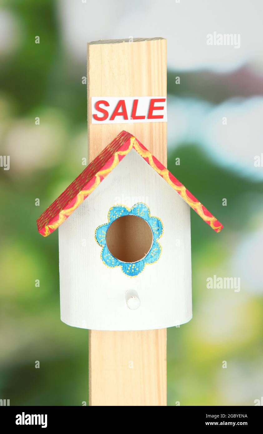 Decorative nesting box and sign on bright background Stock Photo Alamy