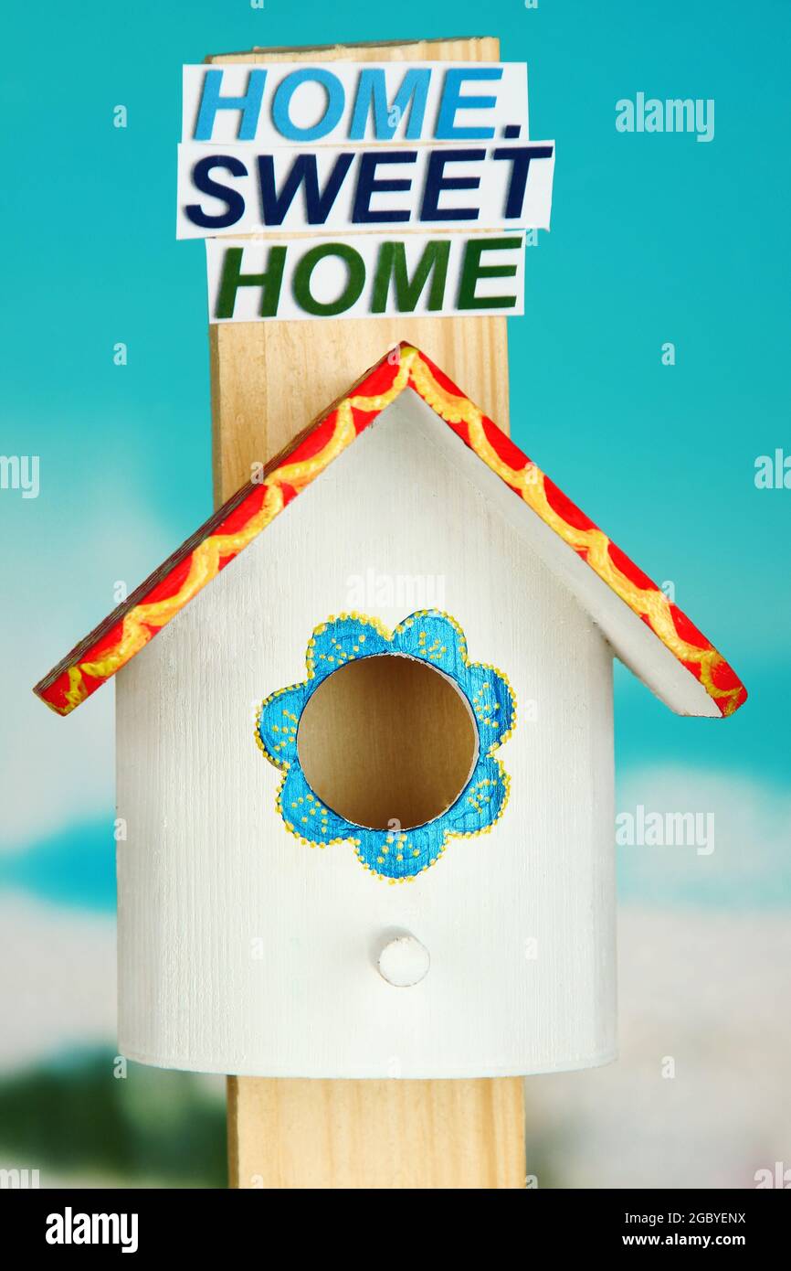 Decorative nesting box and sign on bright background Stock Photo Alamy