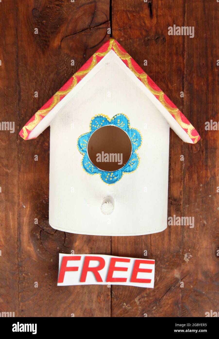 Decorative nesting box and sign on wooden background Stock Photo Alamy