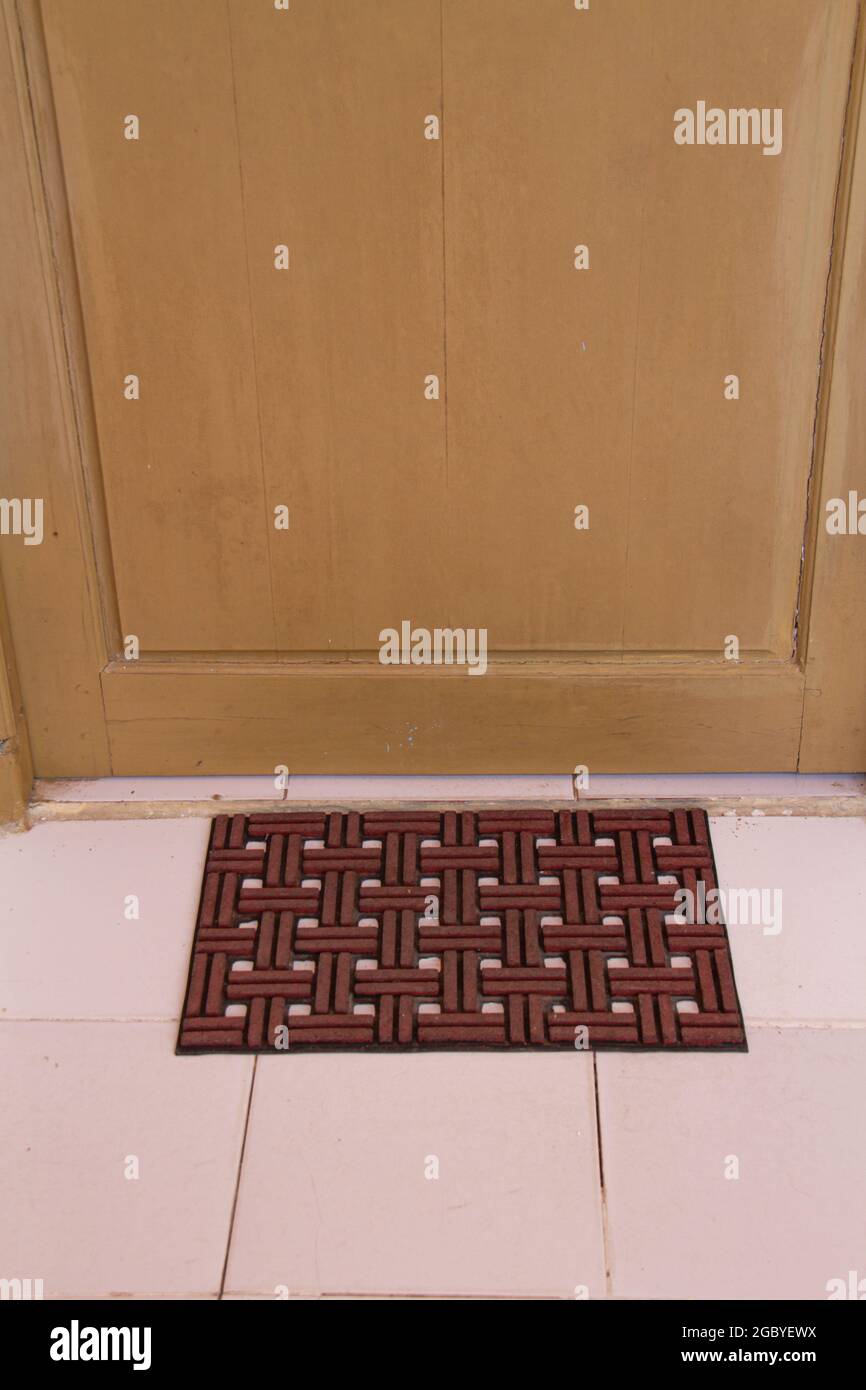 Rubber door mat entrance mat at front door. Stock Photo