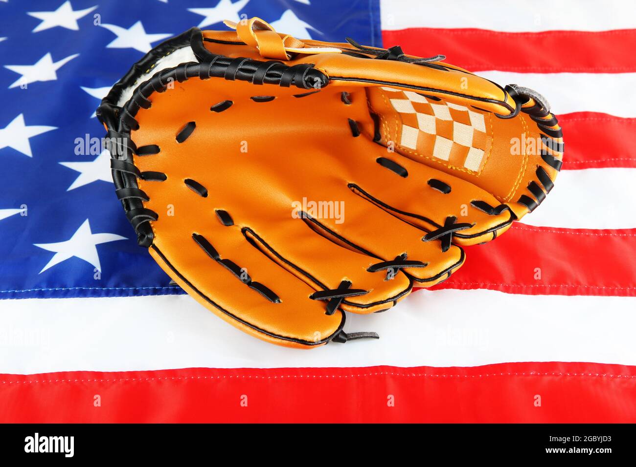 Baseball glove on American flag background Stock Photo - Alamy