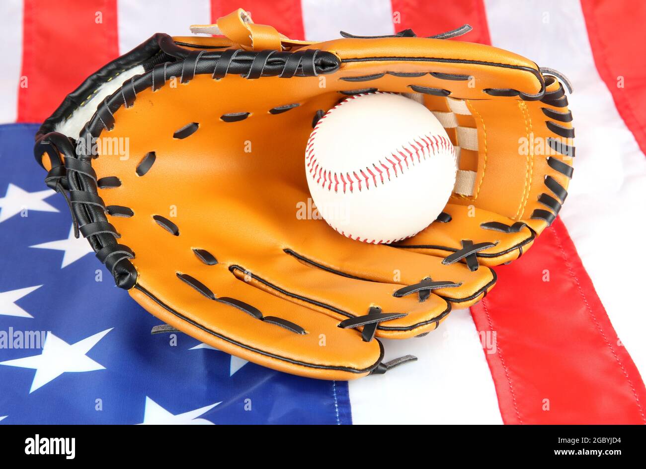 Baseball glove and ball on American flag background Stock Photo - Alamy