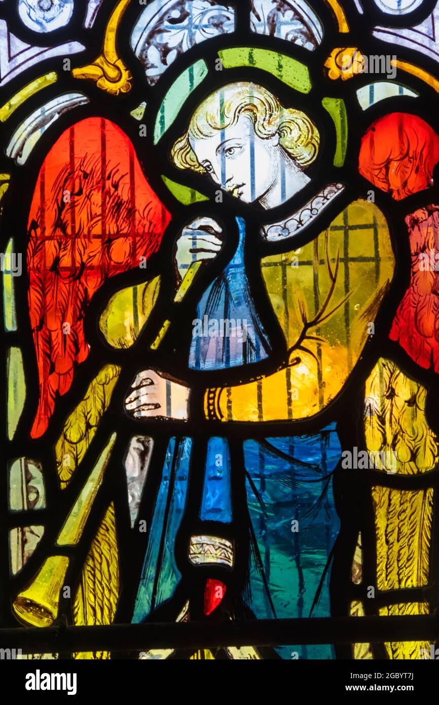 England, Hampshire, Test Valley, King's Somborne, The Parish Church of St.Peter and St.Paul, Stained Glass Window depicting an Angel Playing Music Stock Photo