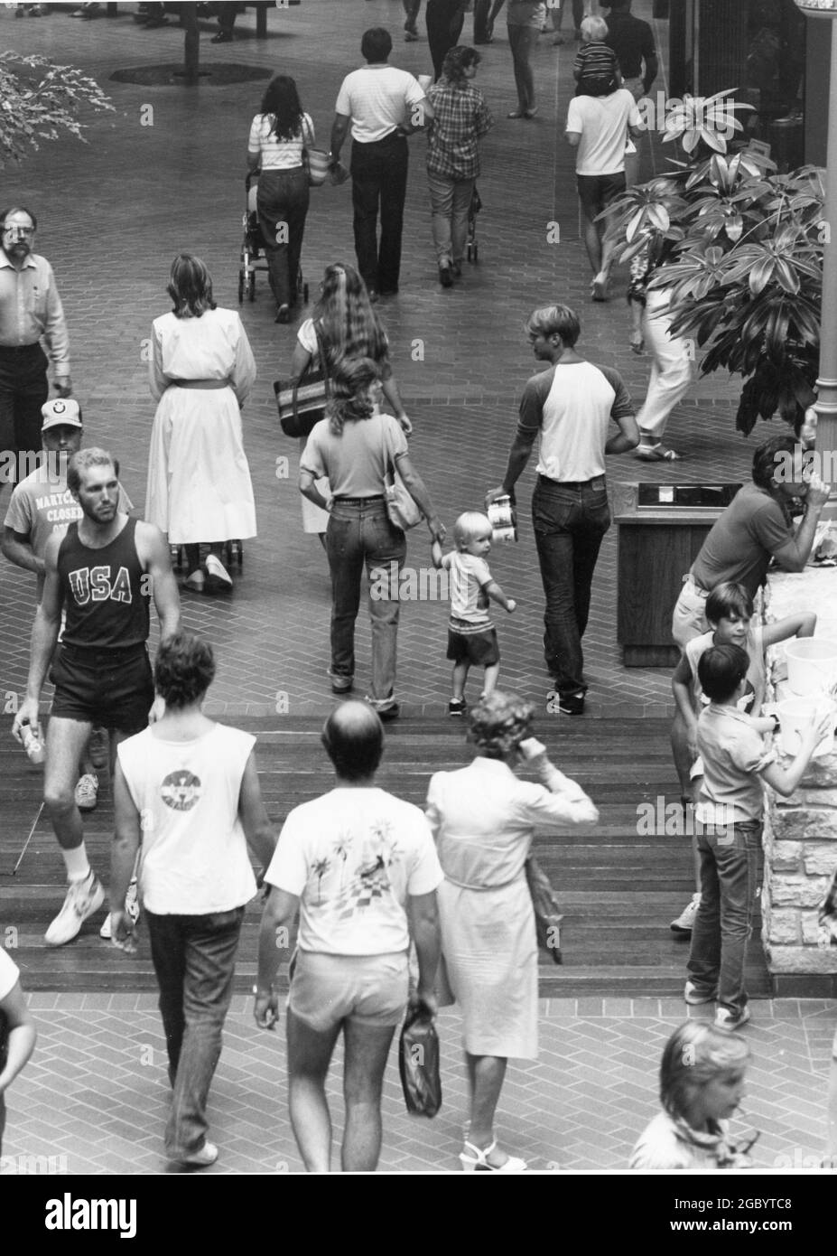 Austin Texas USA, circa 1990: Casually dressed crowd of shoppers enjoy climate-controlled environment of indoor shopping mall at Christmas time.  ©Bob Daemmrich Stock Photo