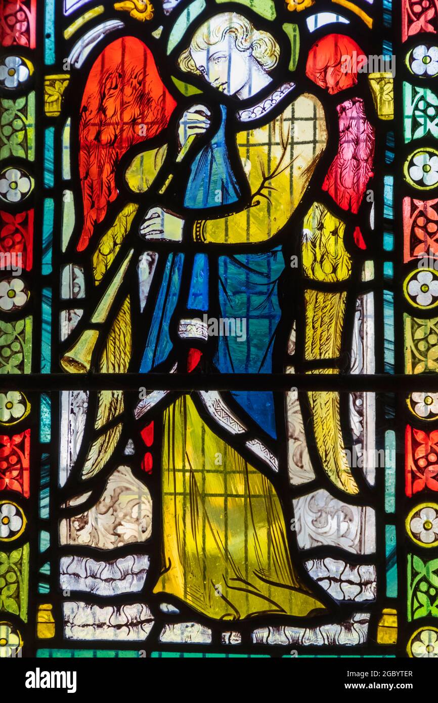England, Hampshire, Test Valley, King's Somborne, The Parish Church of St.Peter and St.Paul, Stained Glass Window depicting an Angel Playing Music Stock Photo