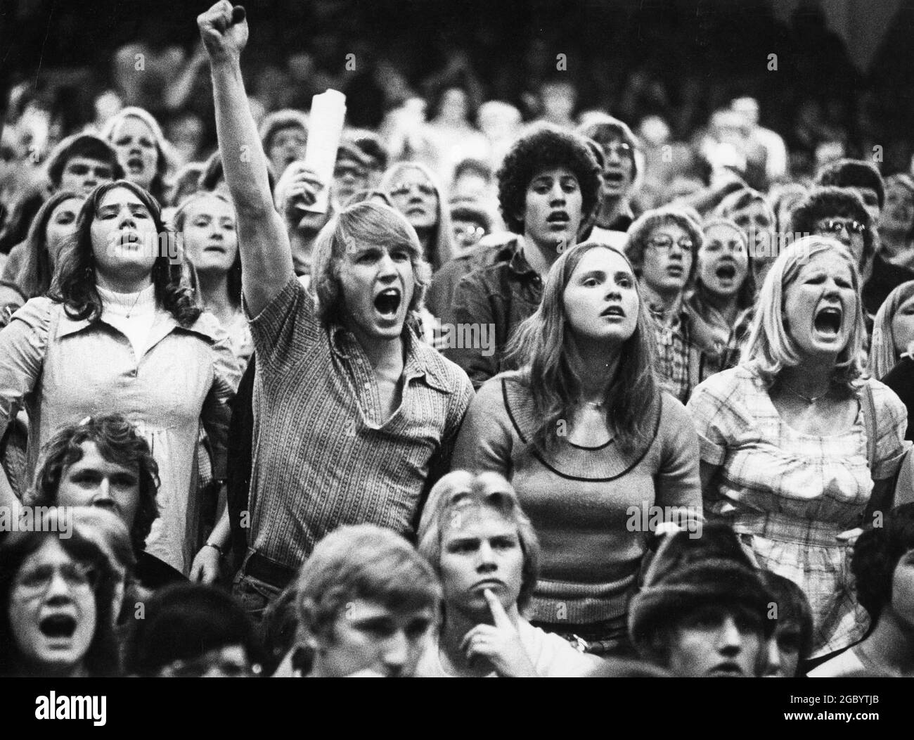 Madison Wisconsin USA, circa 1973: Fans cheer at the high school wrestling state championship meet. ©Bob Daemmrich Stock Photo