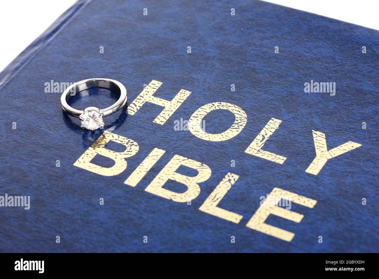 Wedding rings on bible Stock Photo Alamy