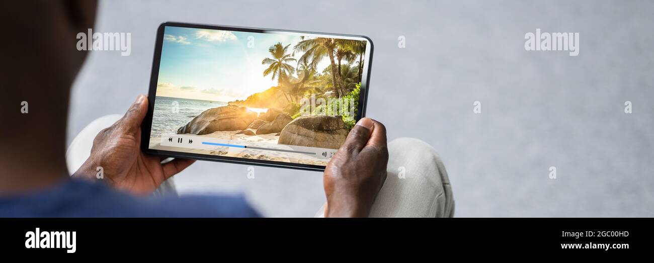 Watching Movie Online Or TV On Tablet Stock Photo