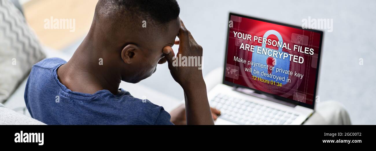 Ransomware Extortion Attack On Laptop. Cyber Security Stock Photo