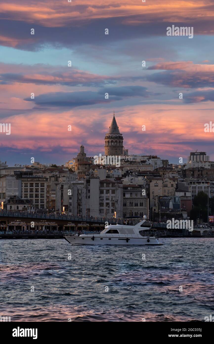Cityscape of a part of Istanbul city showing homes and Galata tower at sunset at the Harborside Eminönü. Stock Photo