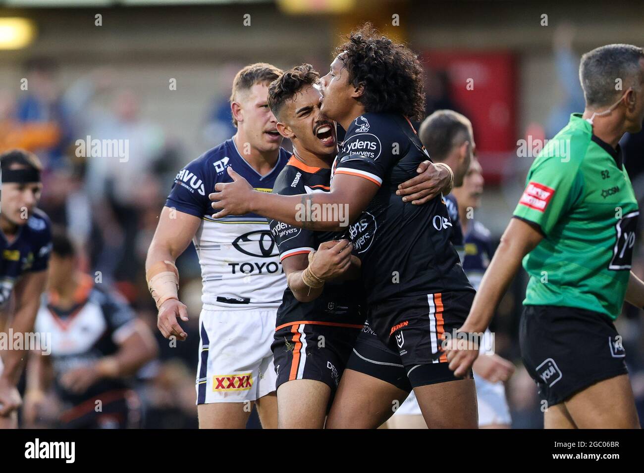 SYDNEY, AUSTRALIA - APRIL 11: Luciano Leilua of the Tigers scores a try and  celebrates with Daine Laurie of the Tigers during the round five NRL match  between the Wests Tigers and