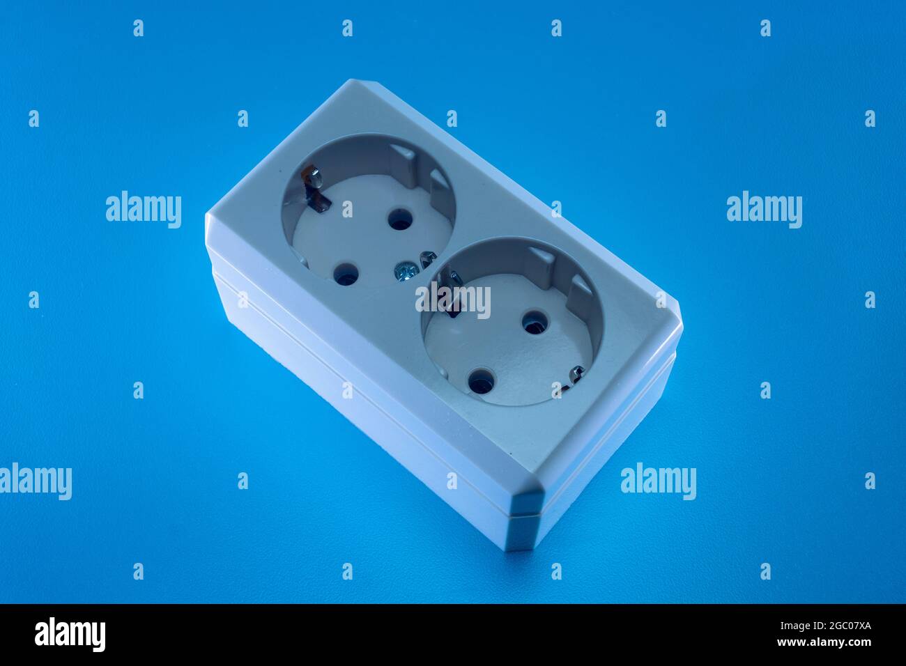 Electric double socket on a blue background Stock Photo