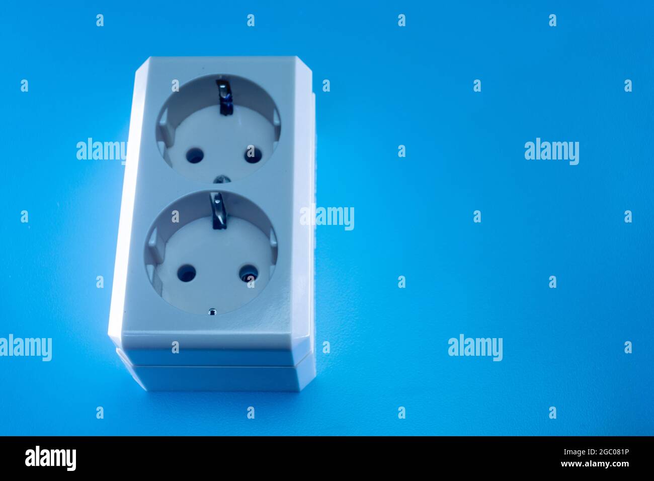 Electric double socket on a blue background Stock Photo