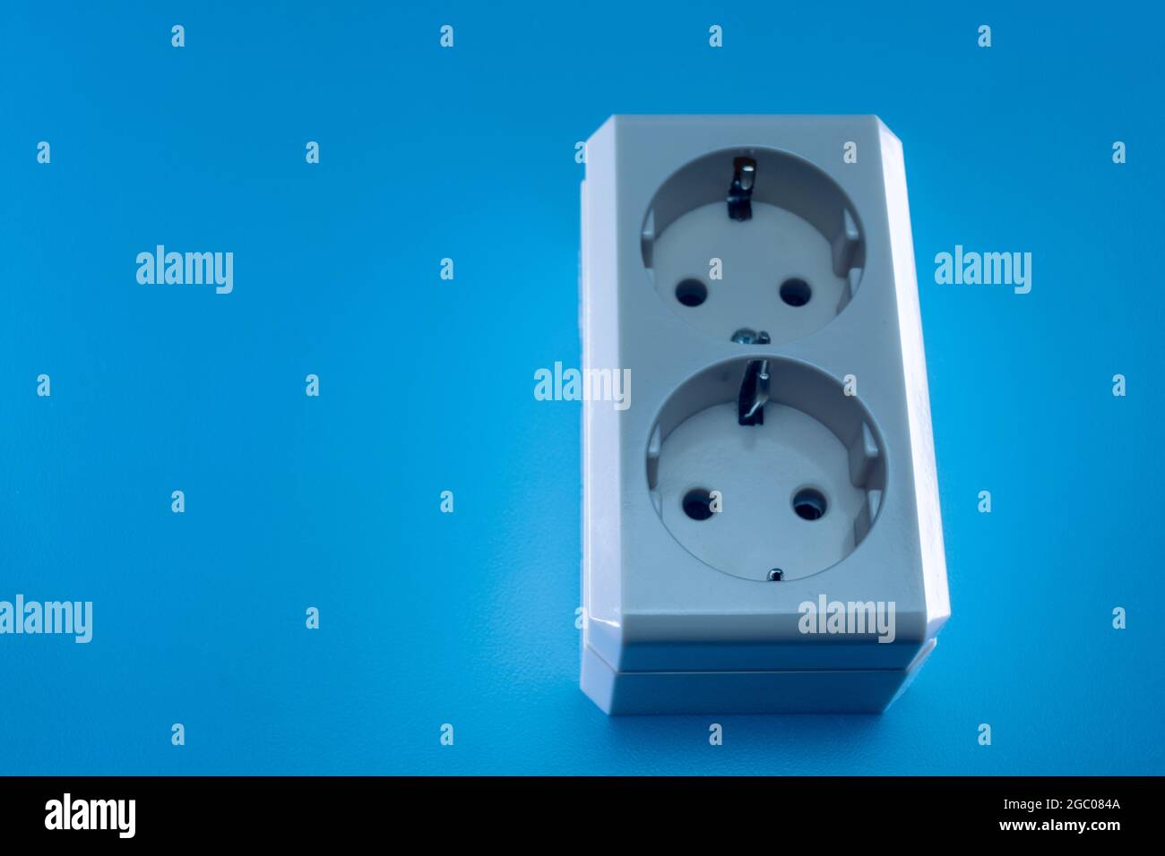 Electric double socket on a blue background Stock Photo