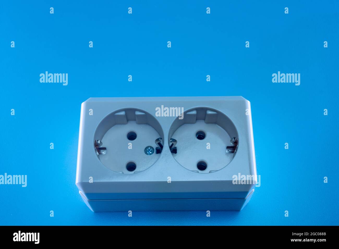 Electric double socket on a blue background Stock Photo