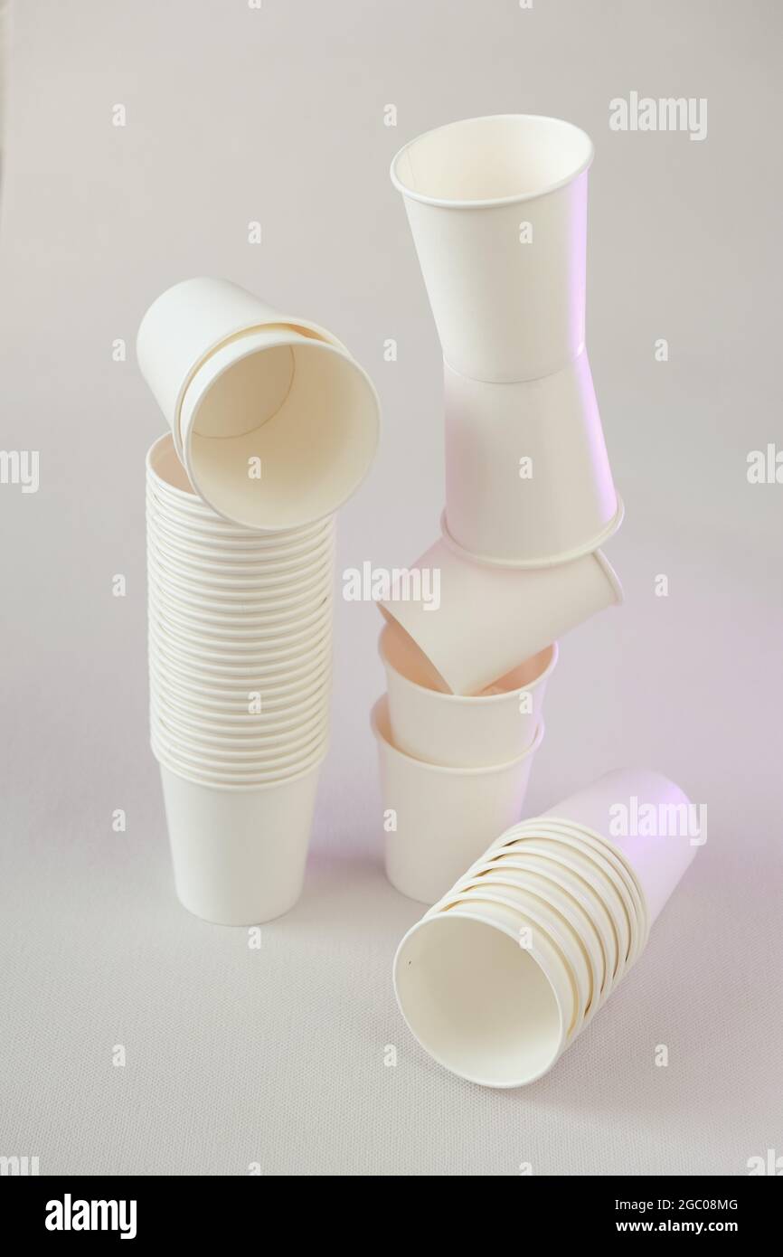 https://c8.alamy.com/comp/2GC08MG/plastic-free-disposable-tableware-without-plasticzero-waste-bamboo-organic-cups-white-paper-cups-on-beige-backgroundpaper-bamboo-cups-set-2GC08MG.jpg