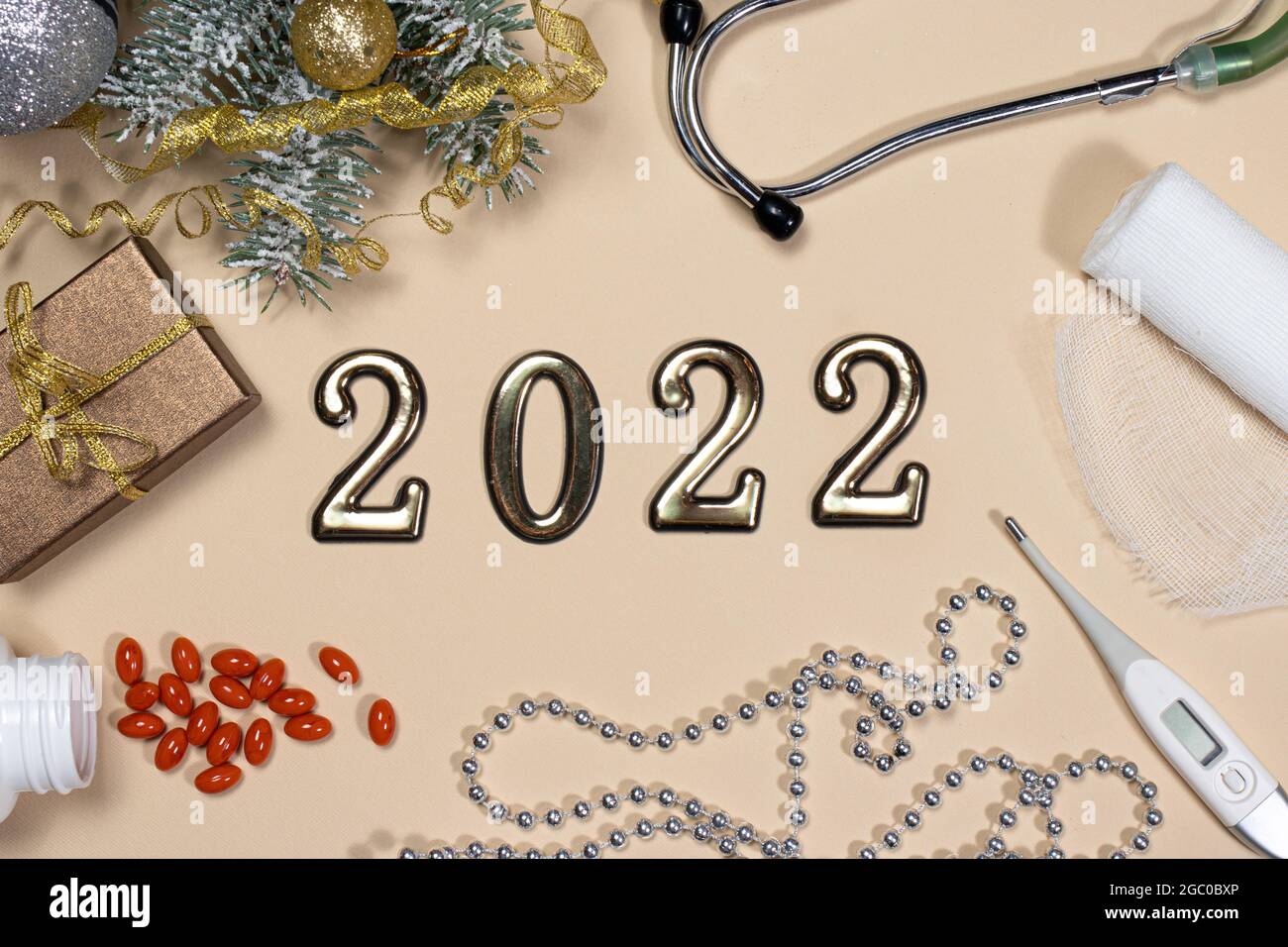 Christmas 2022 Tablets New Year 2022 Medicine. Card On Medical Subjects: Phonendoscope, Tablets,  Thermometer And Bandage With Spruce Branch On A Beige Background Stock  Photo - Alamy