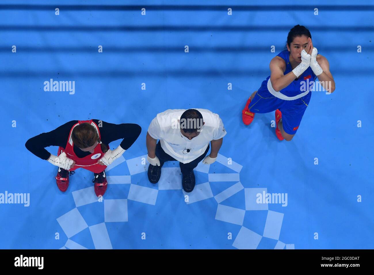 Li Quan Boxing Tokyo, Japan. 6th Aug, 2021. Li Qian (blue) of China celebrates after ...