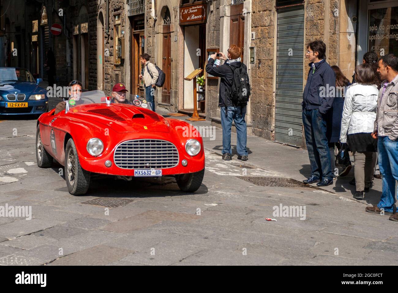 Florence, Italy - May 8, 2010: FERRARI 166 MM Touring Barchetta s/n 0056M (1950) in the rally Mille Miglia 2010 edition on a busy street in Florence. Stock Photo