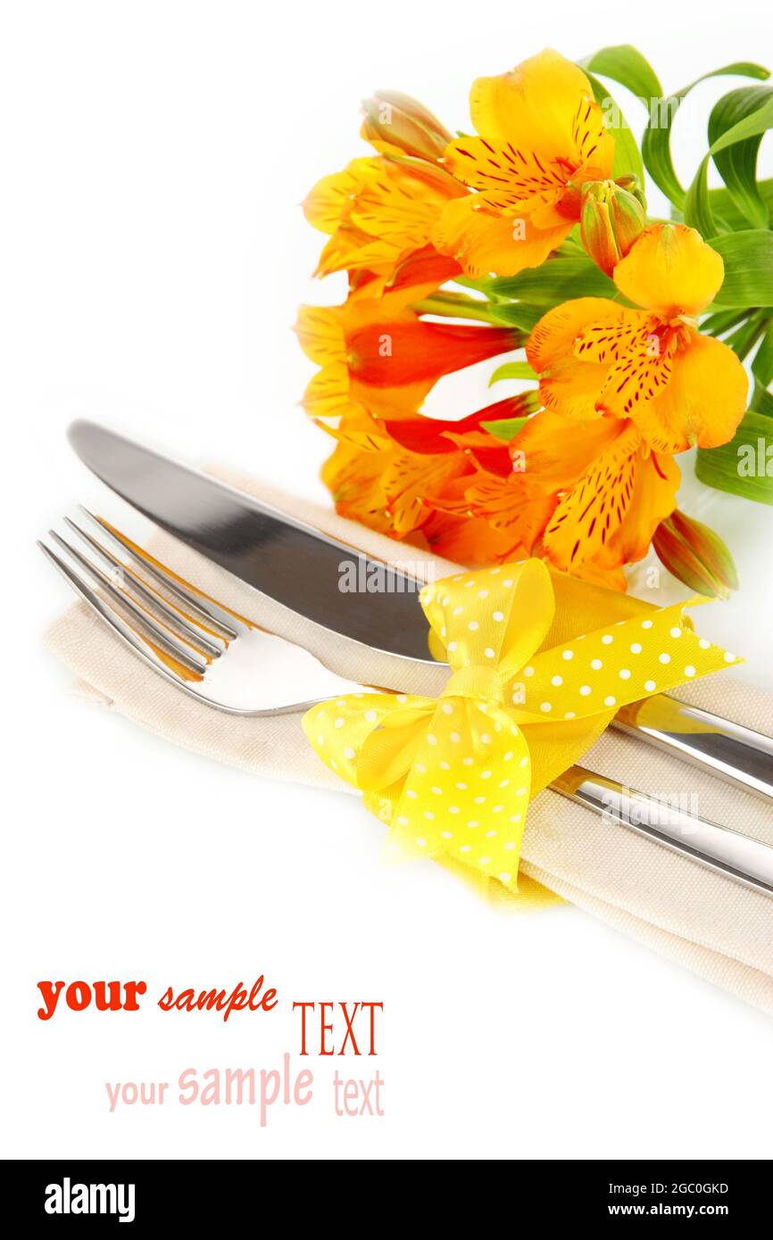 Festive dining table setting with flowers isolated on white Stock Photo