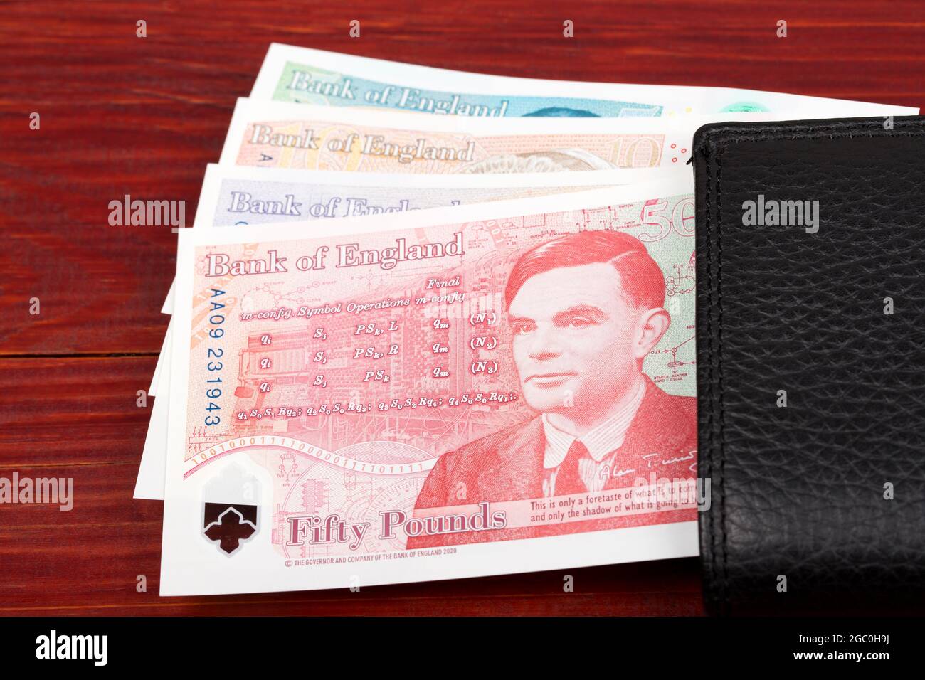 English Pounds in the black wallet Stock Photo Alamy