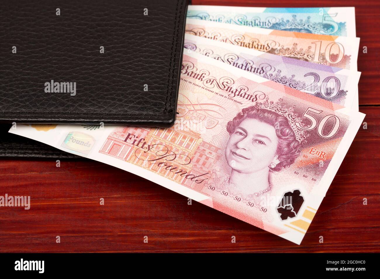 English Pounds in the black wallet Stock Photo Alamy