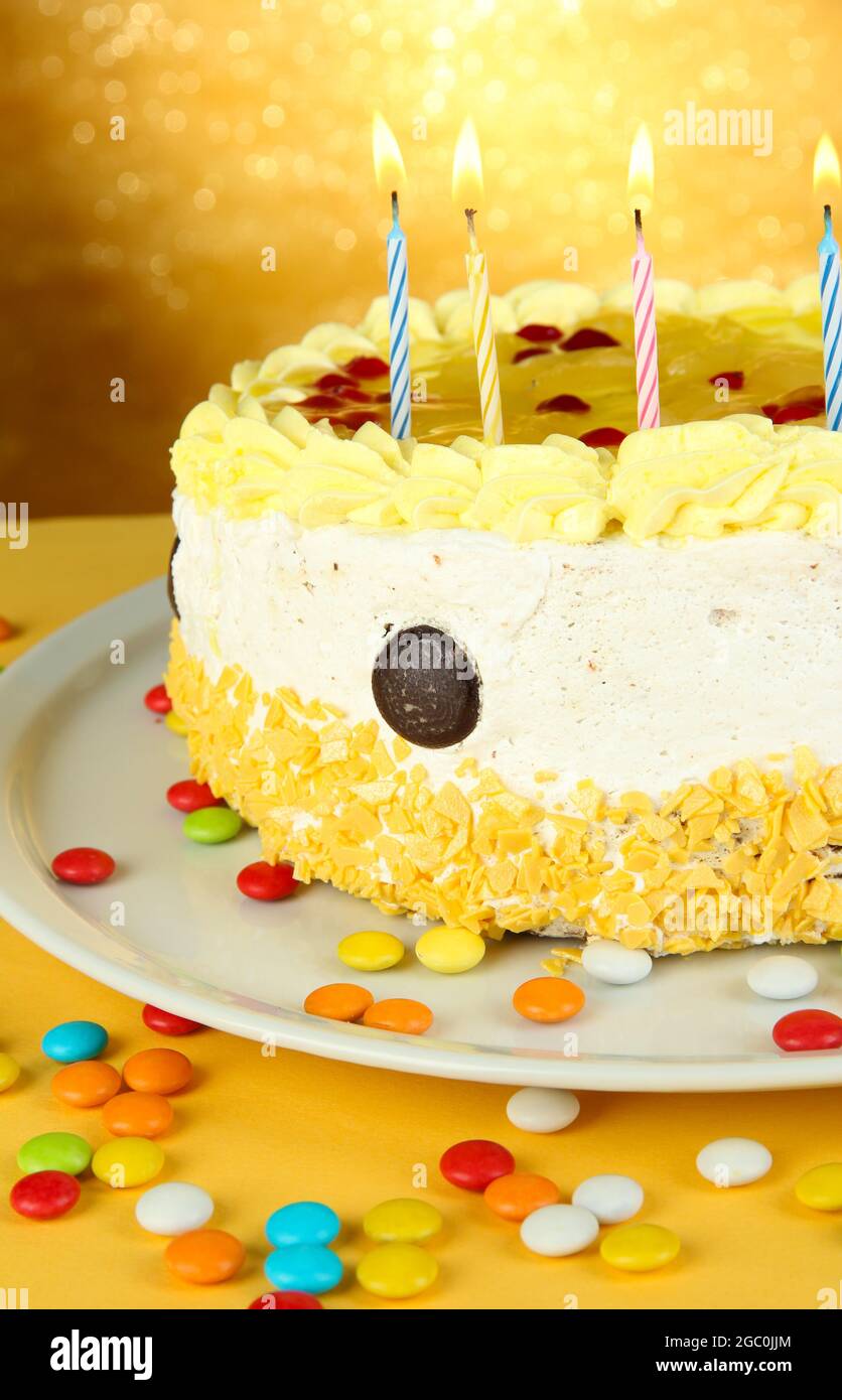 Happy birthday cake, on yellow background Stock Photo