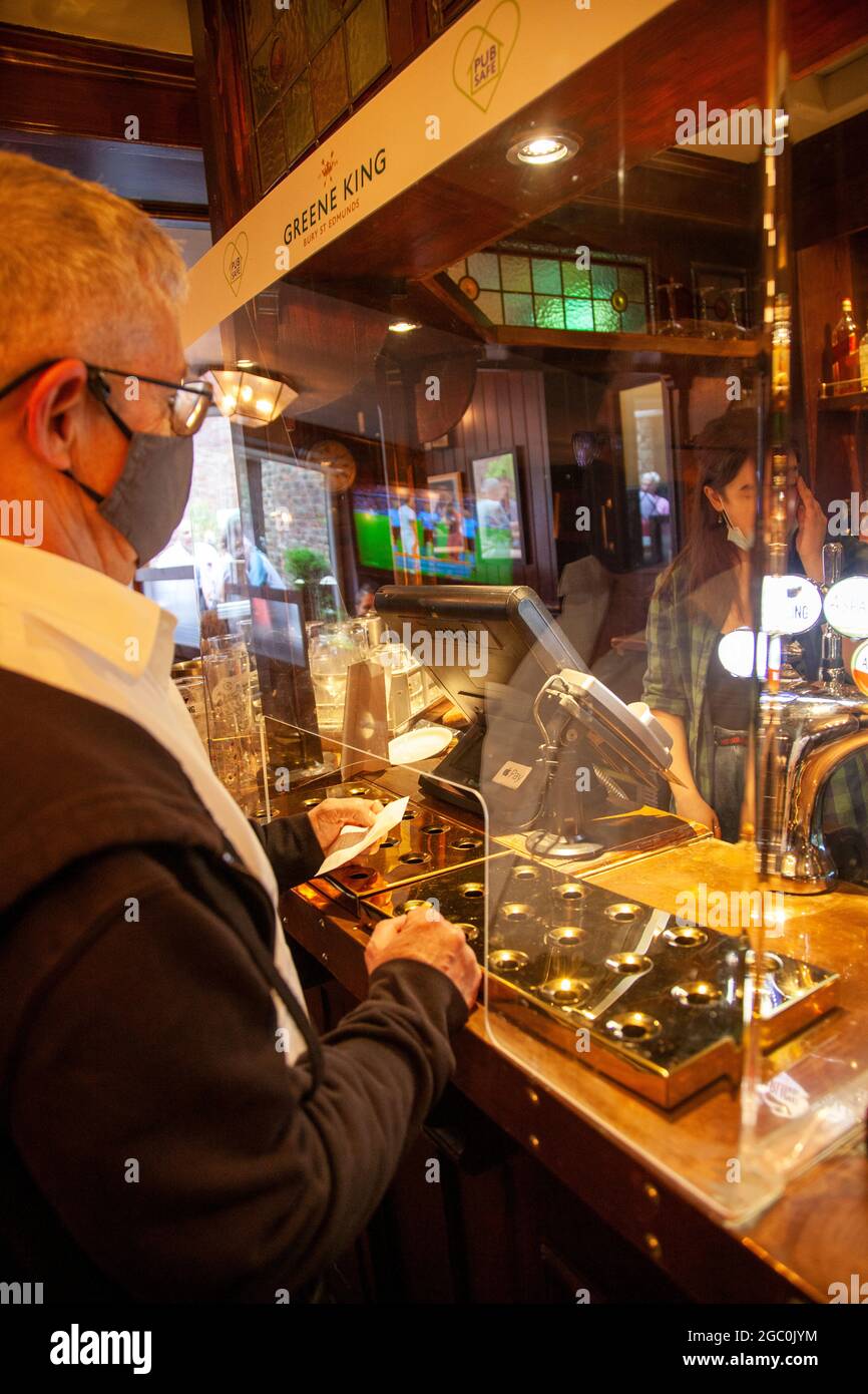 Man Paying for Drinks at Ye Olde Starre Inne Pub in York, UK Stock Photo