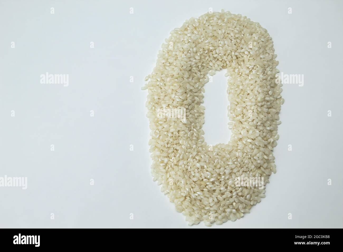 view from above of a heap of rice with circle shape on white background