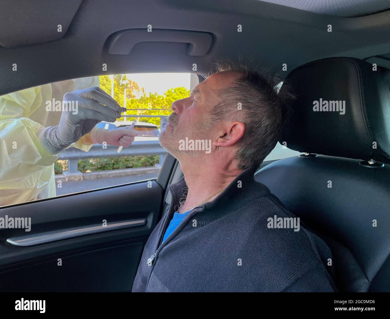 PCR nose swab for covid 19 in drive through testing clinic Stock Photo