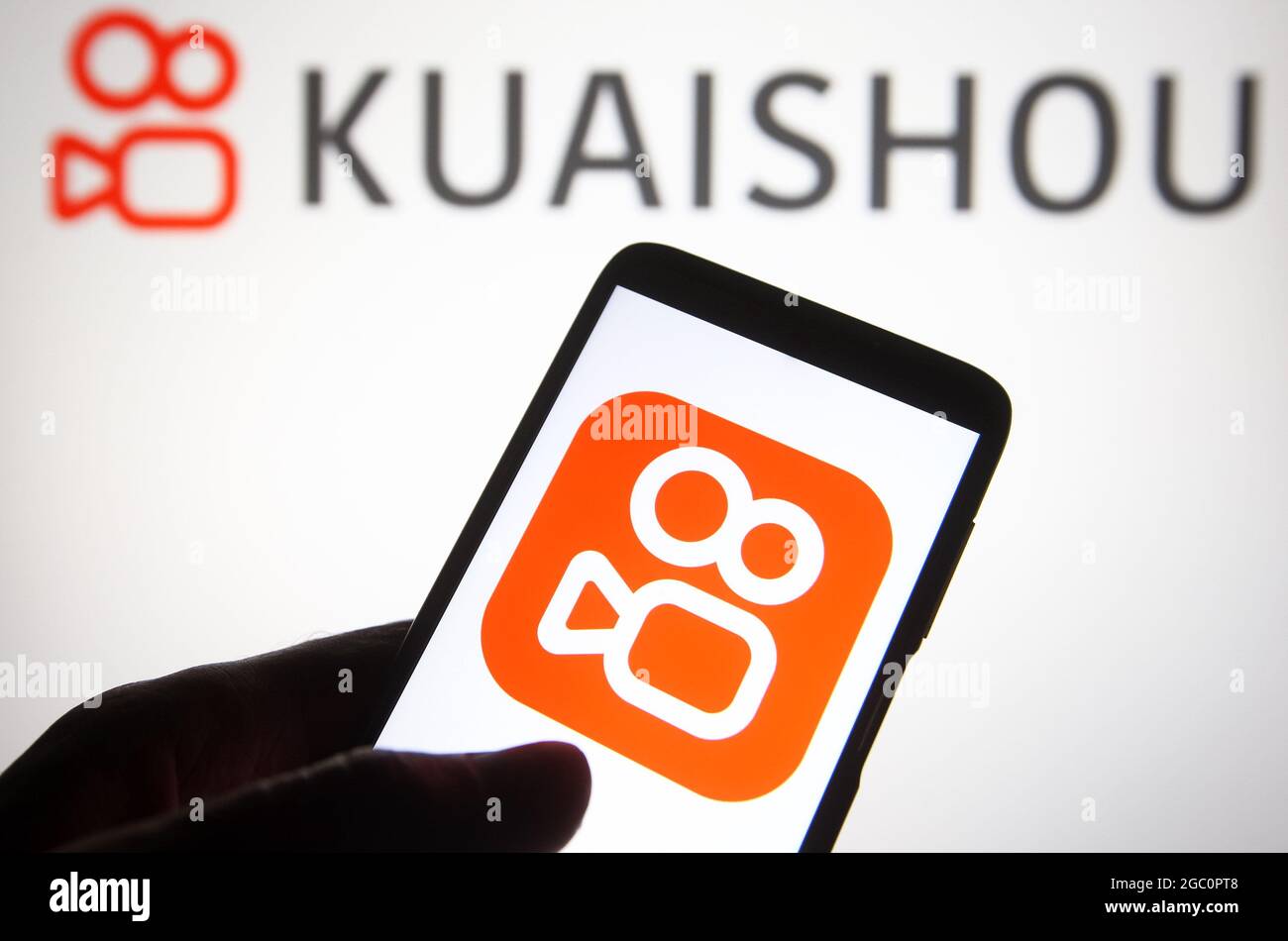 In this photo illustration a Kuaishou (Kwai) logo is seen on a smartphone  and a pc screen. (Photo by Pavlo Gonchar / SOPA Images/Sipa USA Stock Photo  - Alamy