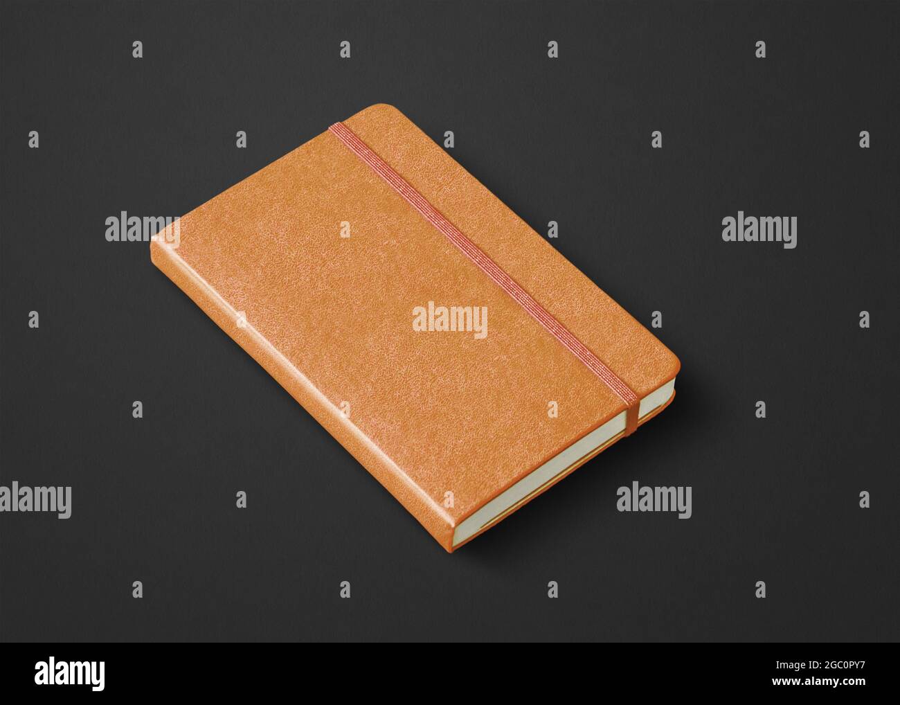 Orange leather closed notebook mockup isolated on black Stock Photo